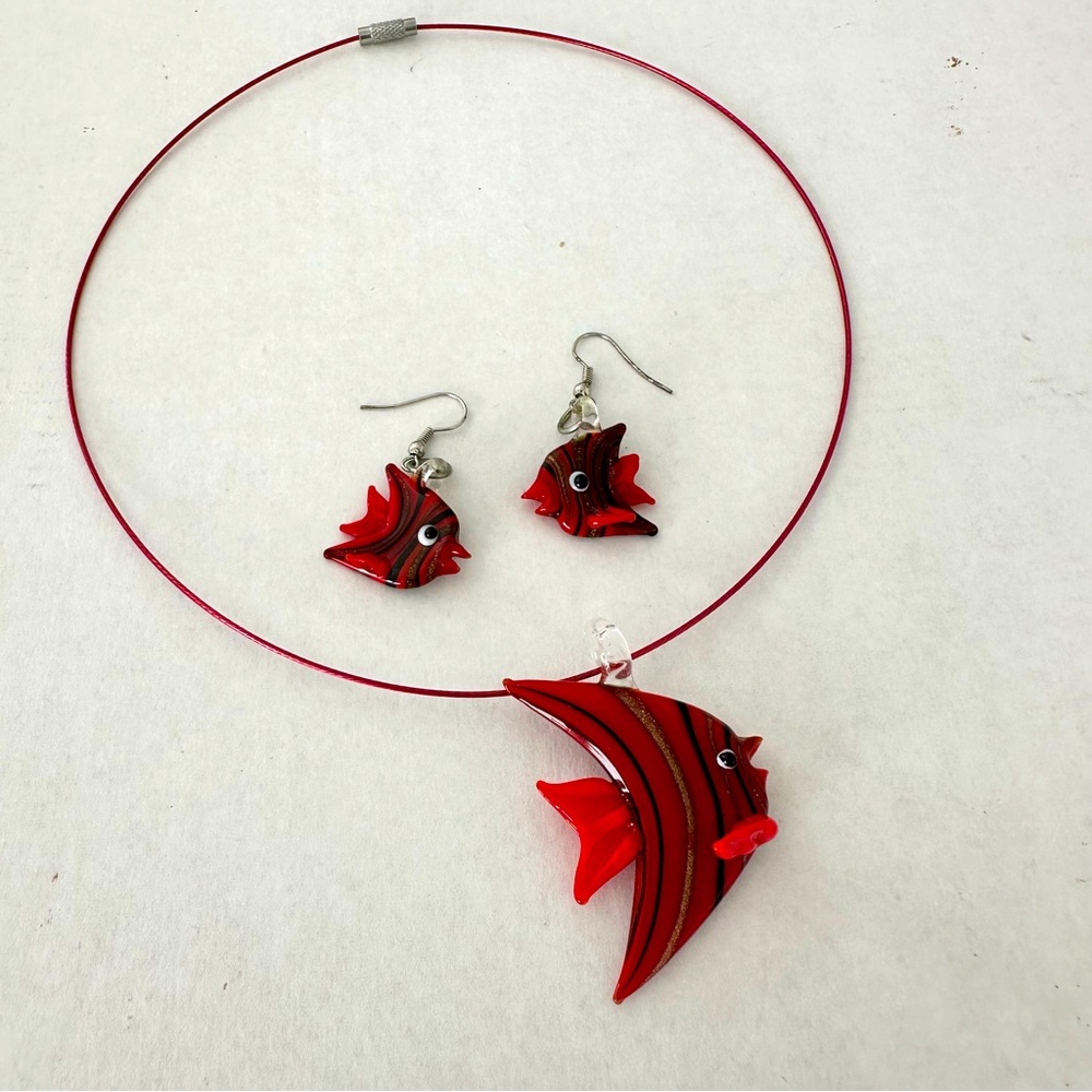 Glass pendant and matching glass earrings. String is included.